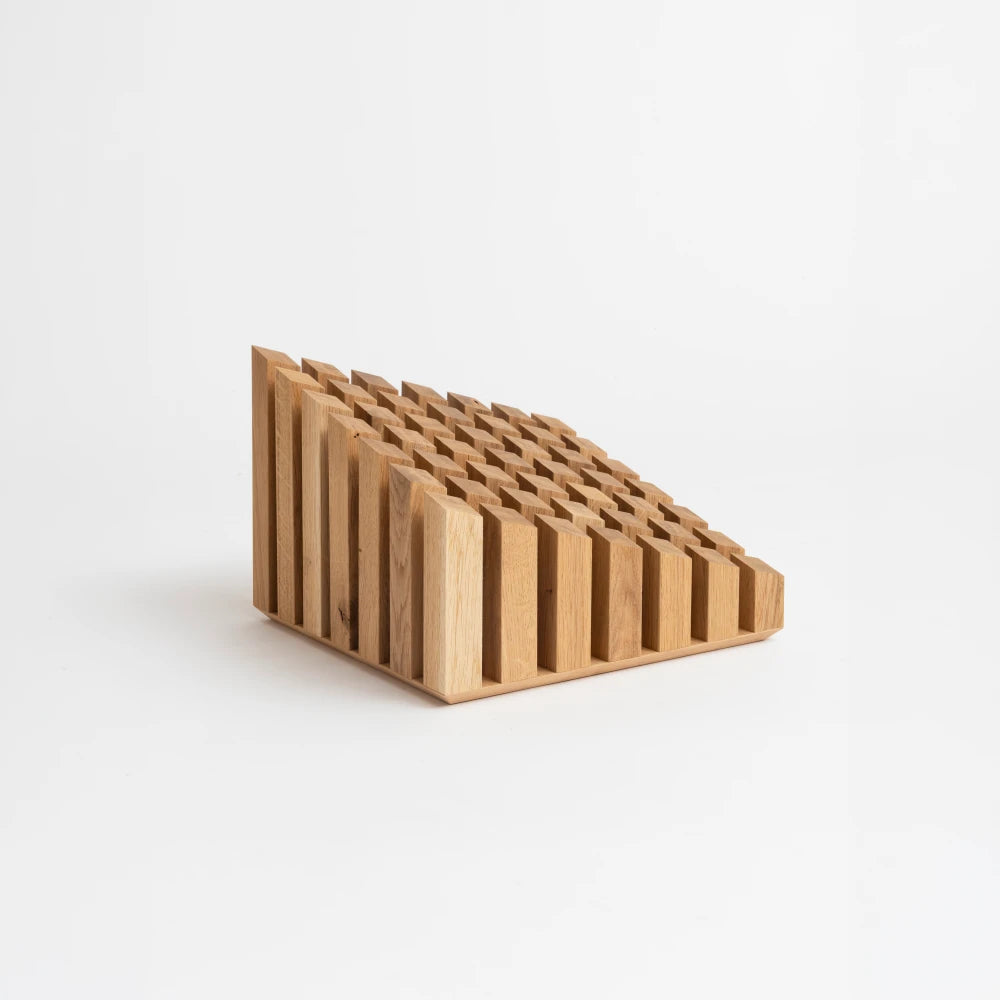 Wooden Cinquante decorative object by Malvin Gaborit, three-quarter view showing its stepped grid and natural grain.